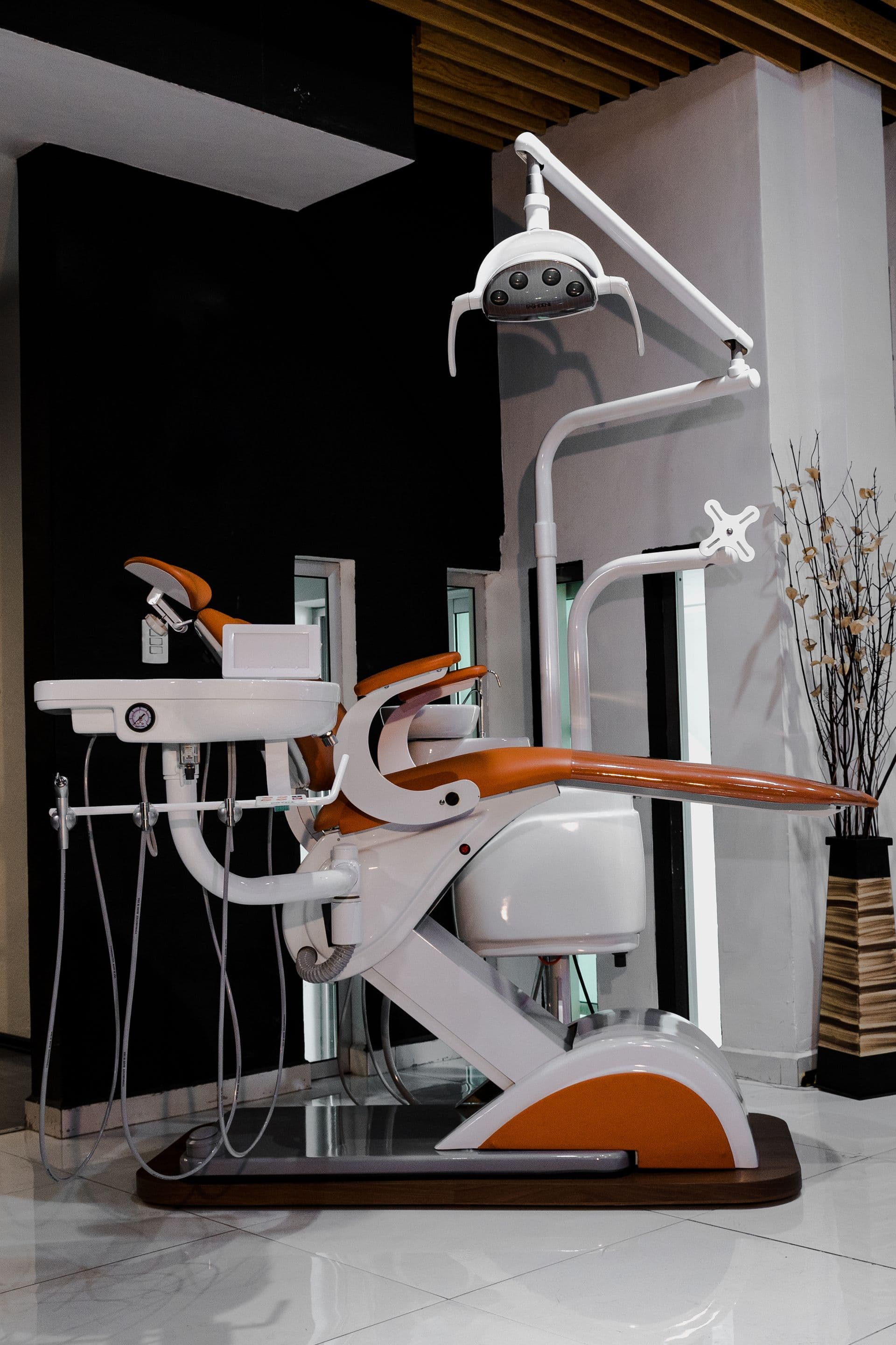 Modern dental chair and operatory light in a treatment room